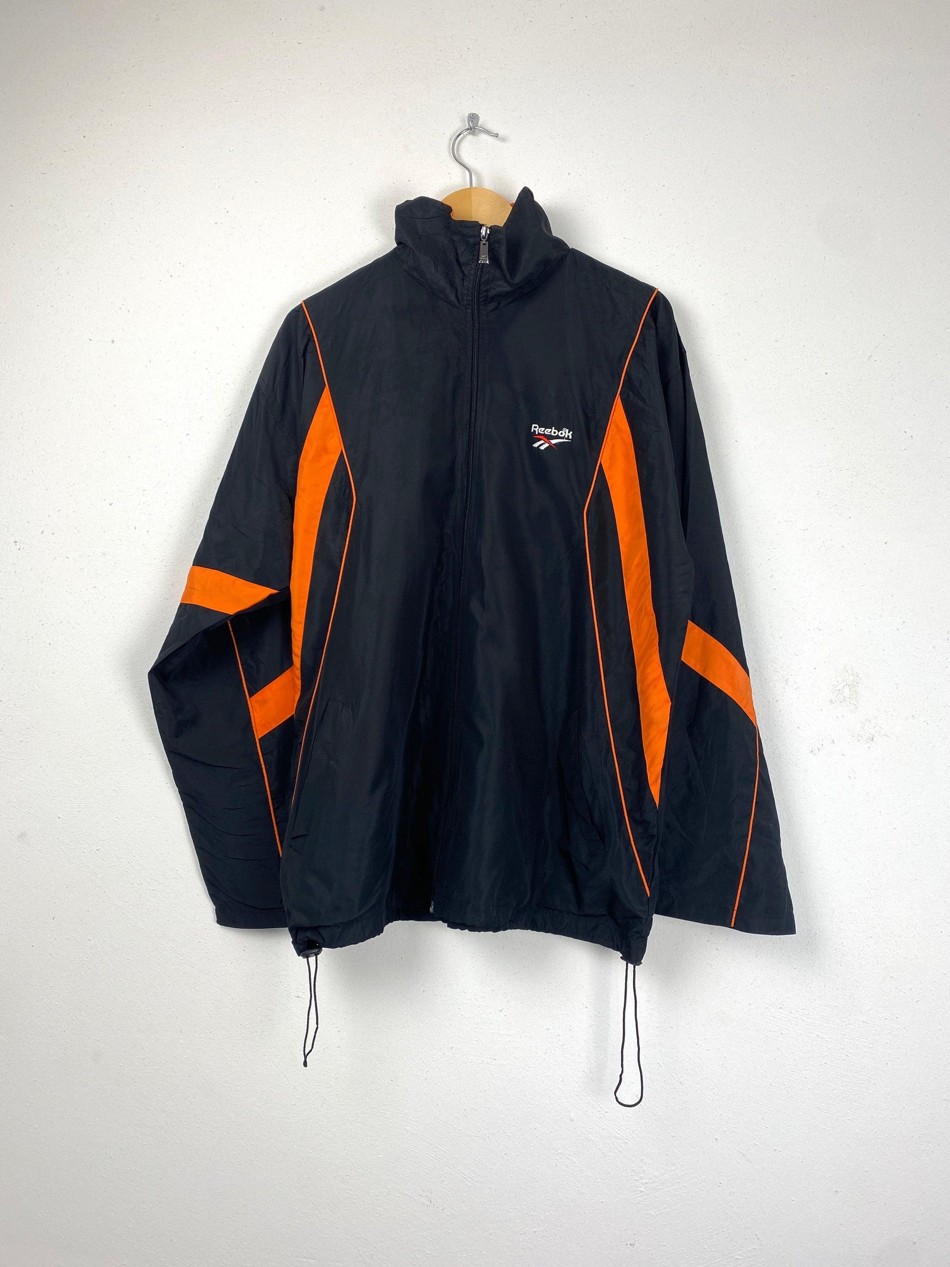 Reebok trainingsjasje zwart oranje - vintageskipakkennl